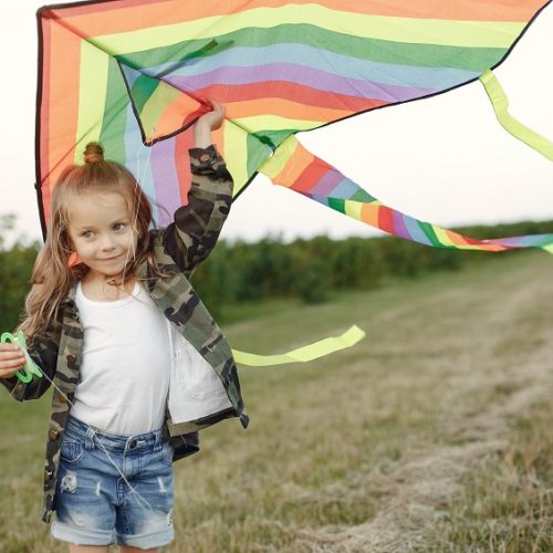 Kid-flying-a-kite-scaled