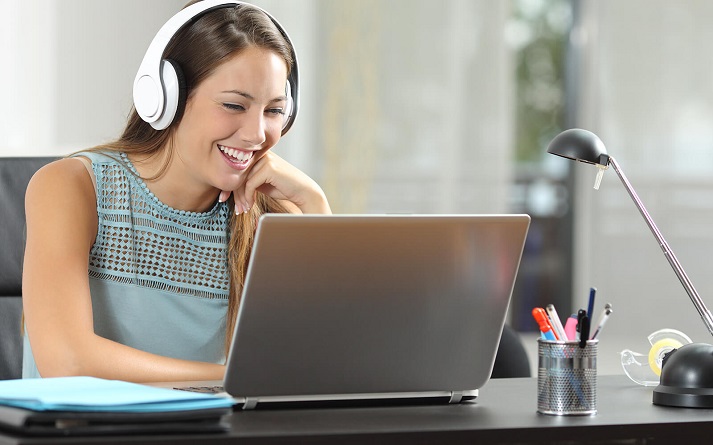 Woman wearing wireless headphones while teaching