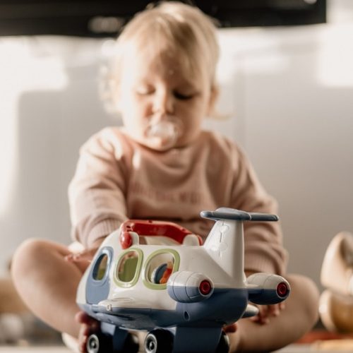 picture of a baby playing with toys