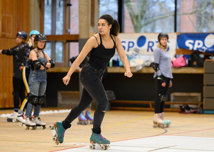 picture of a women riding roller skates in a hall 
