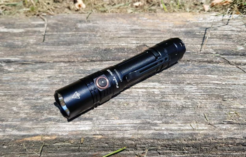 Picture of Fenix PD35 V3.0 Tactical flashlight on a wood