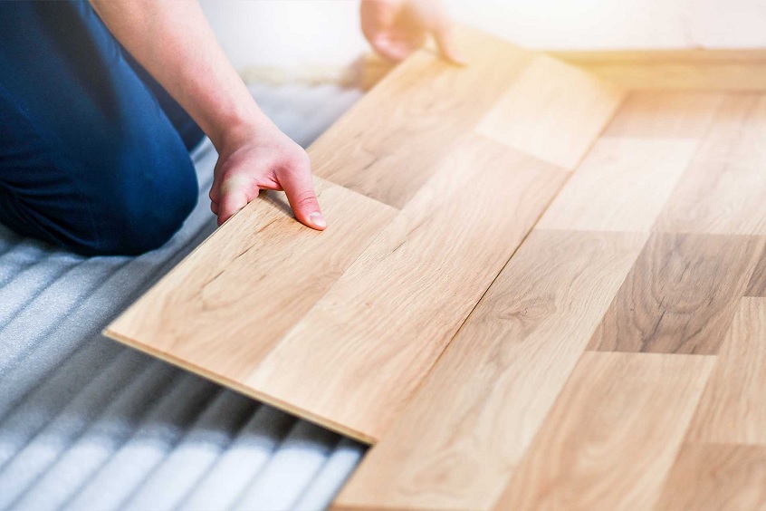 Close-up of installing laminate flooring