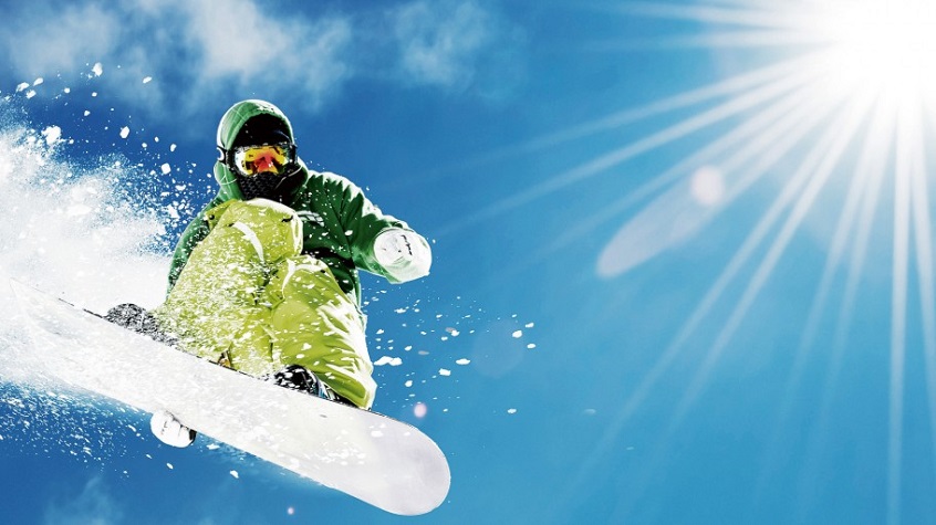 snowboarder dressed in comfy snowboard jacket and pants mid air 