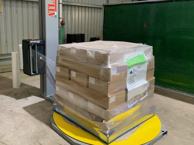 type of a yellow machine for wrapping pallets 