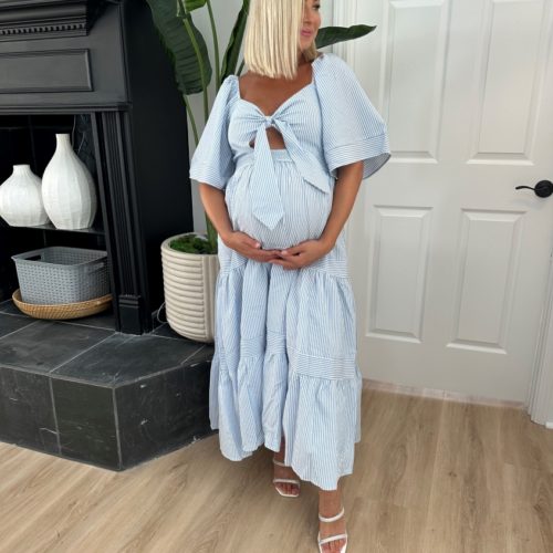 pregnant woman wearing baby shower dress
