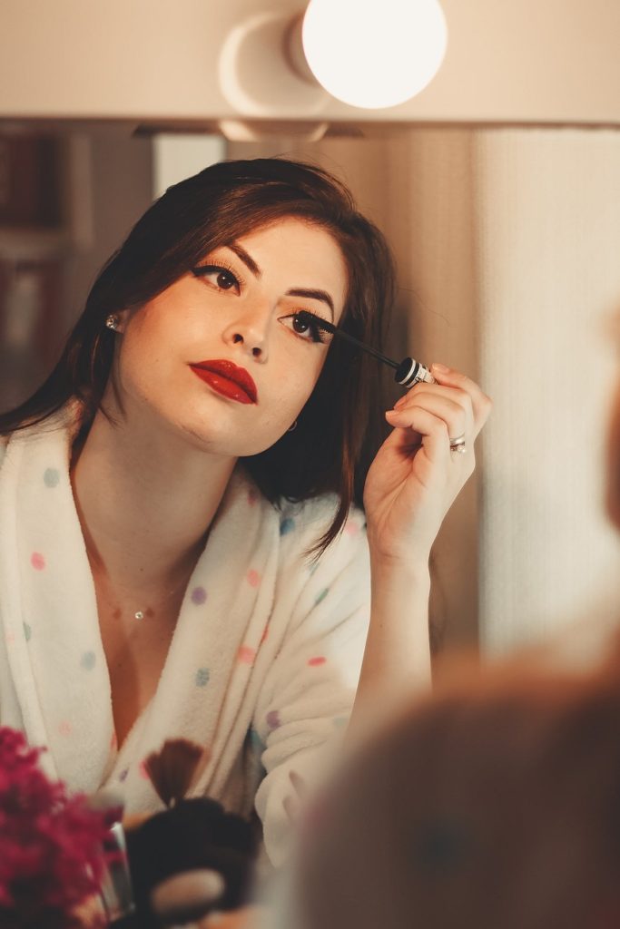 A woman doing makeup